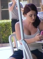 Gorgeous porn slut eats icecream during a lovely summer day and displays her big boobs