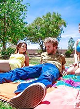 Wavy-haired brunette and her sister enjoying the same cock on a picnic