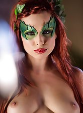 Redheaded Poison Ivy chick decides to tease her pussy with a toy