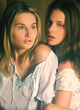 Katya D and Vika Ac strip together on the sofa and have amazing sex together.