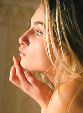 Katya D takes her classy lingerie on the bed and shows us her perky little boobs.