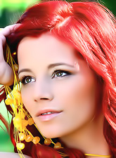 Foxy redhead model Gabrielle Lupin strips her clothes outdoors and shows off.