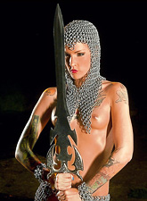 Melodie Gore strips her medieval chainmail outfit off and shows her hot body.