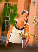 Kortney Kane takes her lingerie outdoors and teases us with her fantastic tight ass.