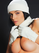 Busty brunette babe Katie Fey strips her clothes and shows her bouncy big jugs.