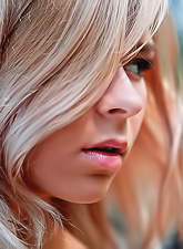 Beautiful blonde model Paloma B strips in the forest and shows us her big jugs.