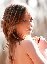 Elle B takes her sexy orange dress outdoors in the woods and shows her hot booty.