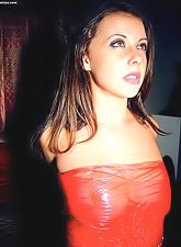 Classy brunette gal Penny Flame strips her red dress and teases in stockings.