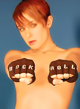 Alluring blonde babe Brittany Avalon strips for the camera and teases in black boots.