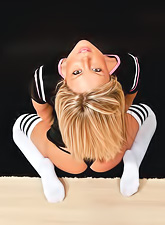 Hot blonde chick Meet Madden strips her clothes and shows her ass in thongs.