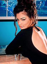 Classy and slutty brunette gal Aria Giovanni teases us in tight slutty black dress.