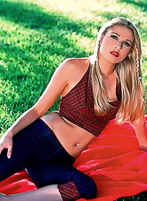 Alluring blonde gal Jenny Fox strips outdoors and plays with her hungry wet cunt.