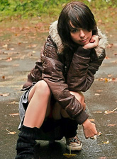 Sexy and cute brunette solo babe, Ariel Rebel, shows her tiny tits outdoors.