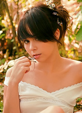 Cute brunette babe Ariel Rebel posing in the forrest and flashing her tiny tits.