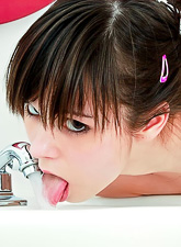 Ariel Rebel uses a long red dildo to grant all kinds of orgasms to her wet pussy.