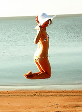 Tireless babe, Ariel Rebel, fools around and enjoys her hot body on a beach.