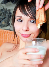 Ariel Rebel gets off her sexy clothes and playing with a glass of milk while posing.