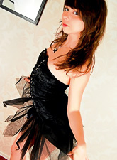 Ariel Rebel posing in a sexy black corset and stroking her sexy and fresh body.