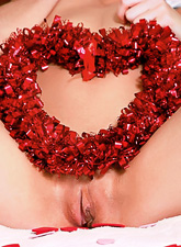 Ariel Rebel presents her clean shaved slit to all her fans as a Valentine gift.