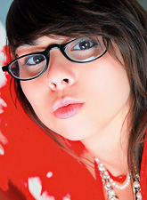 Stunning Ariel Rebel plays with a red boa and pearls as well as with her butt.