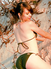 Ariel Rebel posing in her sexy green bikini and showing her amazingly sexy feet.