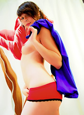 Always decent cutie, Ariel Rebel, poses in red panties and even shows her pink cunt.
