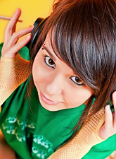 Disobedient girl, Ariel Rebel, smokes a cigarette and listens to her favorite music.