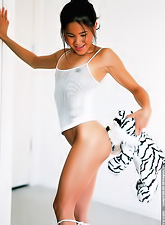 Kitty Yung strips her slutty lingerie before the camera and teases us in thongs.