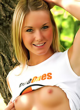 Private Jewel posing in FreeOnes outfit outdoors in the park and hugging a teddy bear.