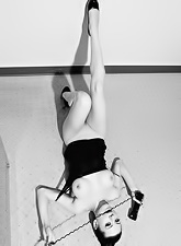Naughty Darenzia poses on camera to show her body on black-and-white photos.