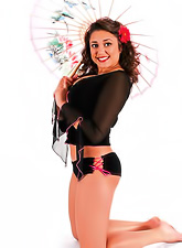 Busty brunette Miriam Gonzalez with sexy legs posing wearing sexy lace lingerie.