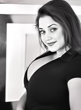 Hot momma Miriam Gonzalez with a nice cleavage doing a black and white photoshoot.