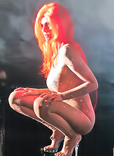 Sexy Julia Ann works at a club at which she dances on stage and teases her fans.