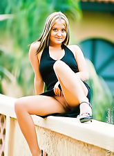 Sexy solo babe, Nicole Parks posing in her sexy black dress and shows her pussy.