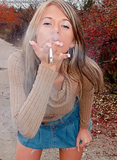 Ann Angel takes her sexy blue skirt off and teases us with her amazing tight.