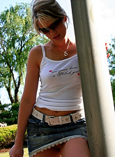 Ann Angel takes her tight denim skirt off before the camera and shows us her hot ass.