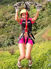 Handsome brunette with big boobies and tanned body Tania Spice posing in pink shorts.