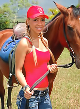 Handsome tanned brunette Tania Spice stripping and reveling big boobes and shaved vag.