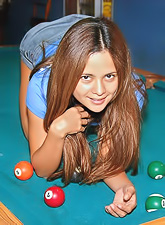 Innocent looking brunette Bella Spice stripping skirt and white thong and showing ass.