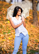 Smoking hot brunette gal Ruth Medina strips her blue jeans outdoors and shows off.