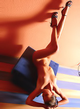 Ashanti A takes her clothes off in front of the camera and teases us in high heels.