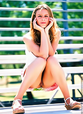 Lusty blonde gal Paulina Presley takes off her mini skirt and shows her trimmed cunt.