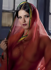 Sunny Leone takes all of her clothes off before the camera and shows us her ass.