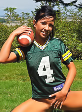 Sporty and naughty Trista Stevens plays naked football on soft and green grass.