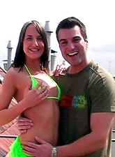 Andy Brown kneels before her handsome lover and sucks big throbbing hard cock.