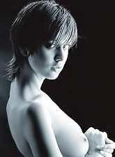 Hilary A wears just her sexy black lingerie as she teases us in front of the camera.