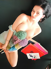 Beautiful and seductive brunette Katie Fey strips in the library and shows off.