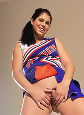 Beautiful teen gal Kylie Rachelle strips her cheerleading uniform and shows her cunt.