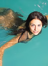 Foxy teen cuttie Felicity Fey takes off her fishnet black dress and shows her body.