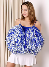 Beautiful teen cheeleader Andi Pink takes off her mini skirt and shows her tight ass.